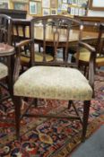 A matched set of eight 19th century mahogany dining chairs, one with arms.