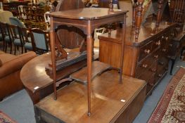 A mahogany two tier occasional table.