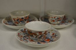 Three Chinese Imari tea bowls and saucers.