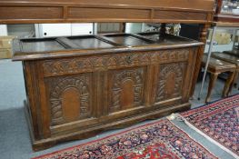 An 18th century carved oak coffer.