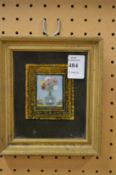 A miniature oil painting of a vase of flowers.