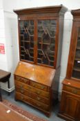 A George III mahogany bureau bookcase.