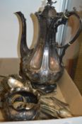 A decorative plated coffee pot and other items.