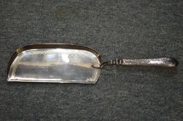 A plated crumb scoop.