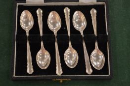 A cased set of six silver coffee spoons.