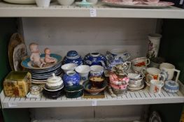 A shelf of decorative china.