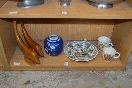 A Chinese blue and white ginger jar, a decorative plate, two mugs and pair of carved wood