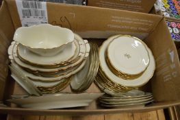 A continental cream porcelain and gilt decorated dinner ware.
