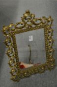 An ornate brass picture frame.