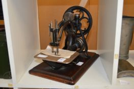 A Willcox & Gibbs sewing machine.