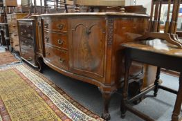 A large mahogany serpentine fronted sideboard.