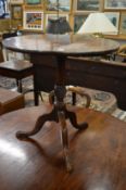A George III mahogany tilt top circular tripod table.