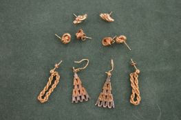 Various gold earrings.