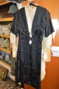 An Edwardian ladies' beadwork decorated black silk coat with lace lining.