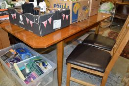 A walnut extending dining table.