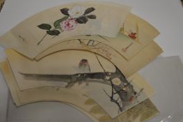 Seven Japanese fan shaped wood block prints.