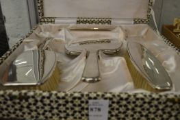 A sterling silver four-piece dressing table set, boxed.