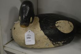 An old painted duck decoy.
