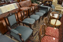 A Victorian carved mahogany framed salon suite comprising armchair, four side chairs and a chaise