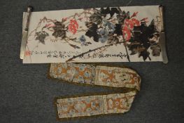 Oriental embroidery and a scroll painting.