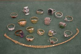 A collection of gold, silver and other rings and a gold chain.