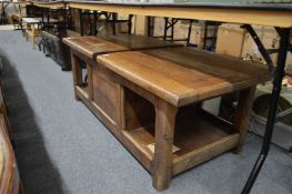 An oak storage coffee table.