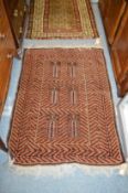 A Persian rug with geometric decoration.