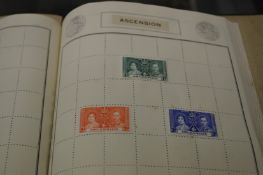 An interesting stamp album containing Royal Commemorative stamps of the Colonies, most depicting the