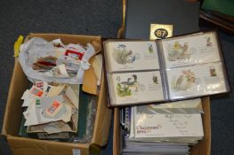 A large quantity of loose stamps, First Day Covers etc.
