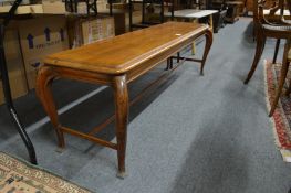 An unusual Edwardian mahogany low table (used in a bank for gentlemen to place their hats on).
