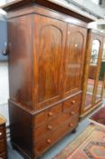 A 19th century mahogany linen press.
