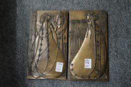 A pair of Art Nouveau style wall plaques.
