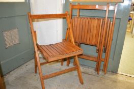 Three folding chairs.