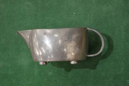 A Liberty & Co Tudric pewter cream jug.