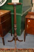 A mahogany jardiniere stand.