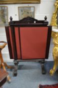 A pair of mahogany fire screens with pull-out panels.