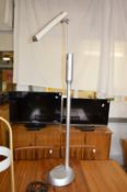 A modern floor standing reading lamp.