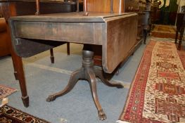 A mahogany pedestal Pembroke table.