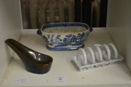 A blue and white dish and two other items.