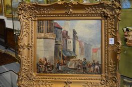 A continental street scene with figures and buildings, oil on canvas, in a decorative gilt frame.