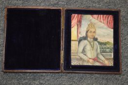 A 19th century Indian miniature portrait in a leather case.