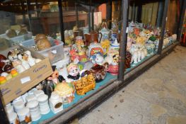 A large quantity of novelty teapots, salt and peppers.
