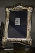 An Art Nouveau silver photograph frame.