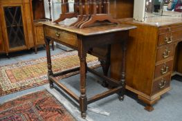 A 18th century oak single draw side table.