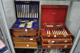 Two mahogany table top part canteens of cutlery and a cutlery box.