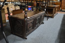 An early carved oak cradle.