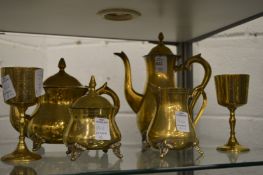 A plated tea and coffee service and a pair of goblets.