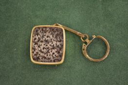 A miniature music box.