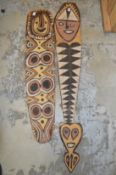Two carved wood tribal totems.