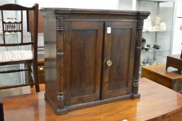 A table top two-door cabinet.
